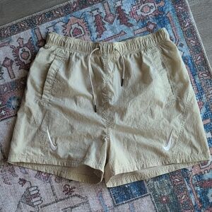 Nike Women's Tan Athletic Nylon Shorts with White Logo Swoosh Detail (Medium)